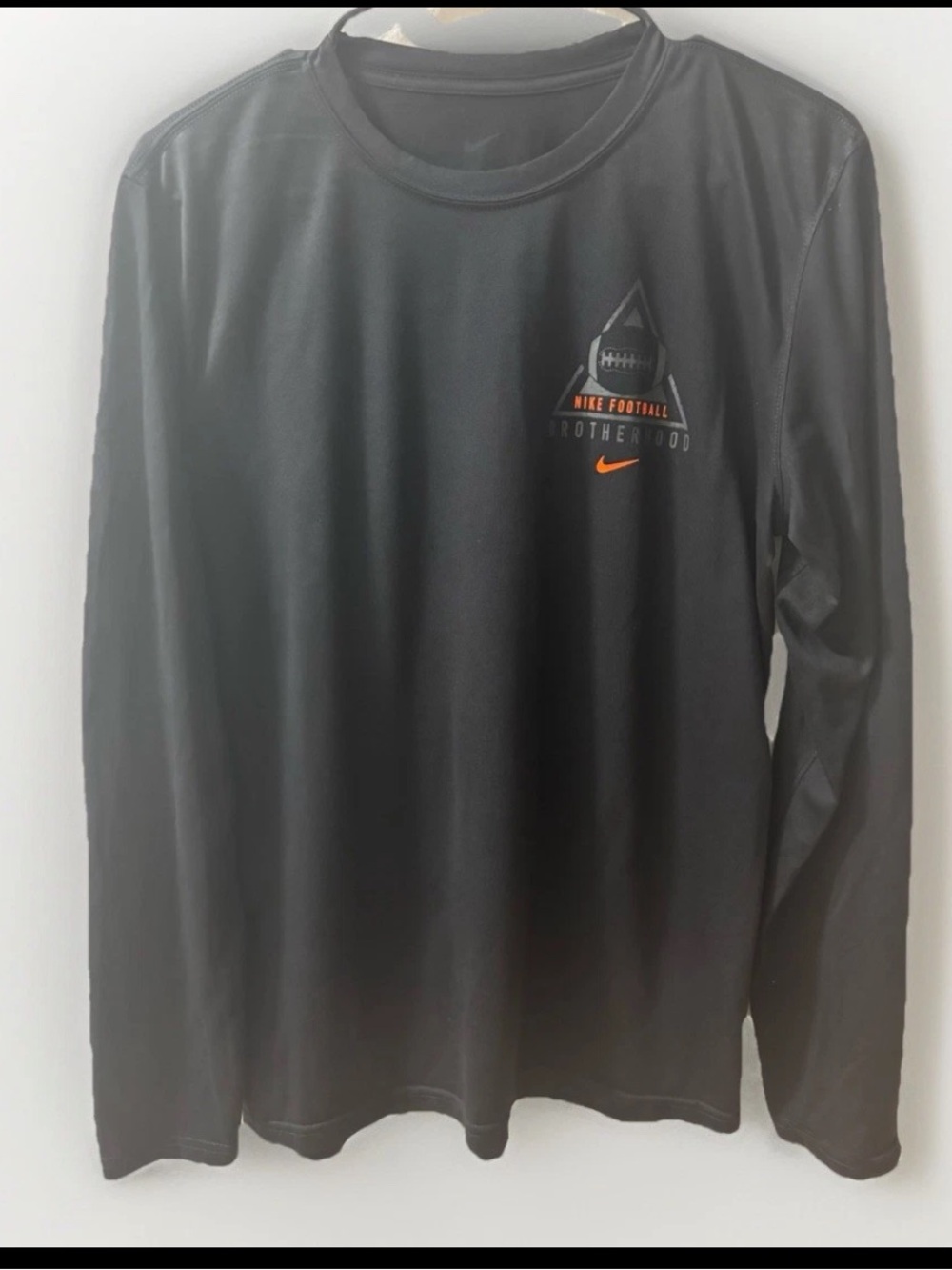 Nike Men’s Black Long-Sleeve Football Logo Tee with Orange Accent